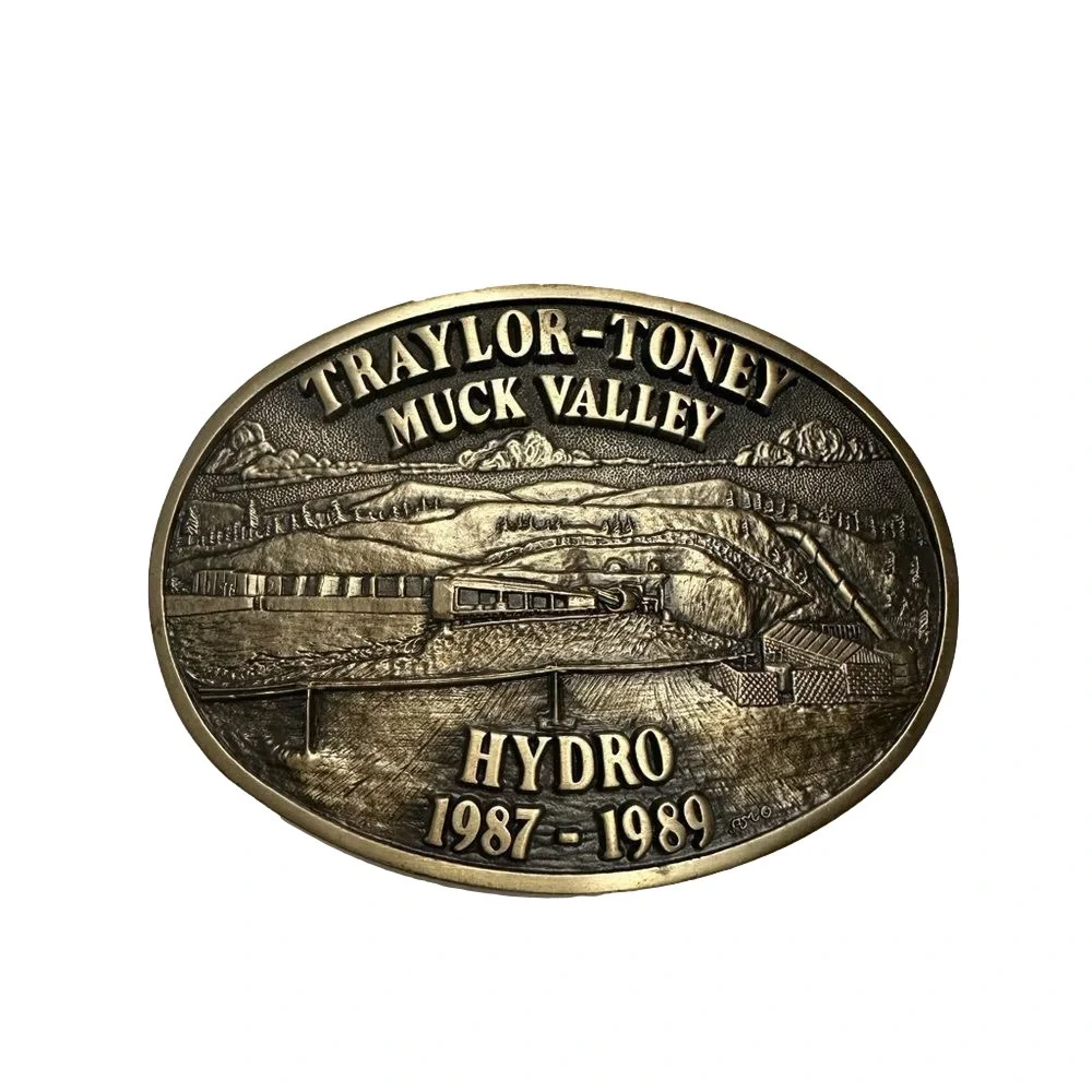 Vintage Solid Brass Traylor-Toney Muck Valley Hydro Belt Buckle 1987-1989 ADM